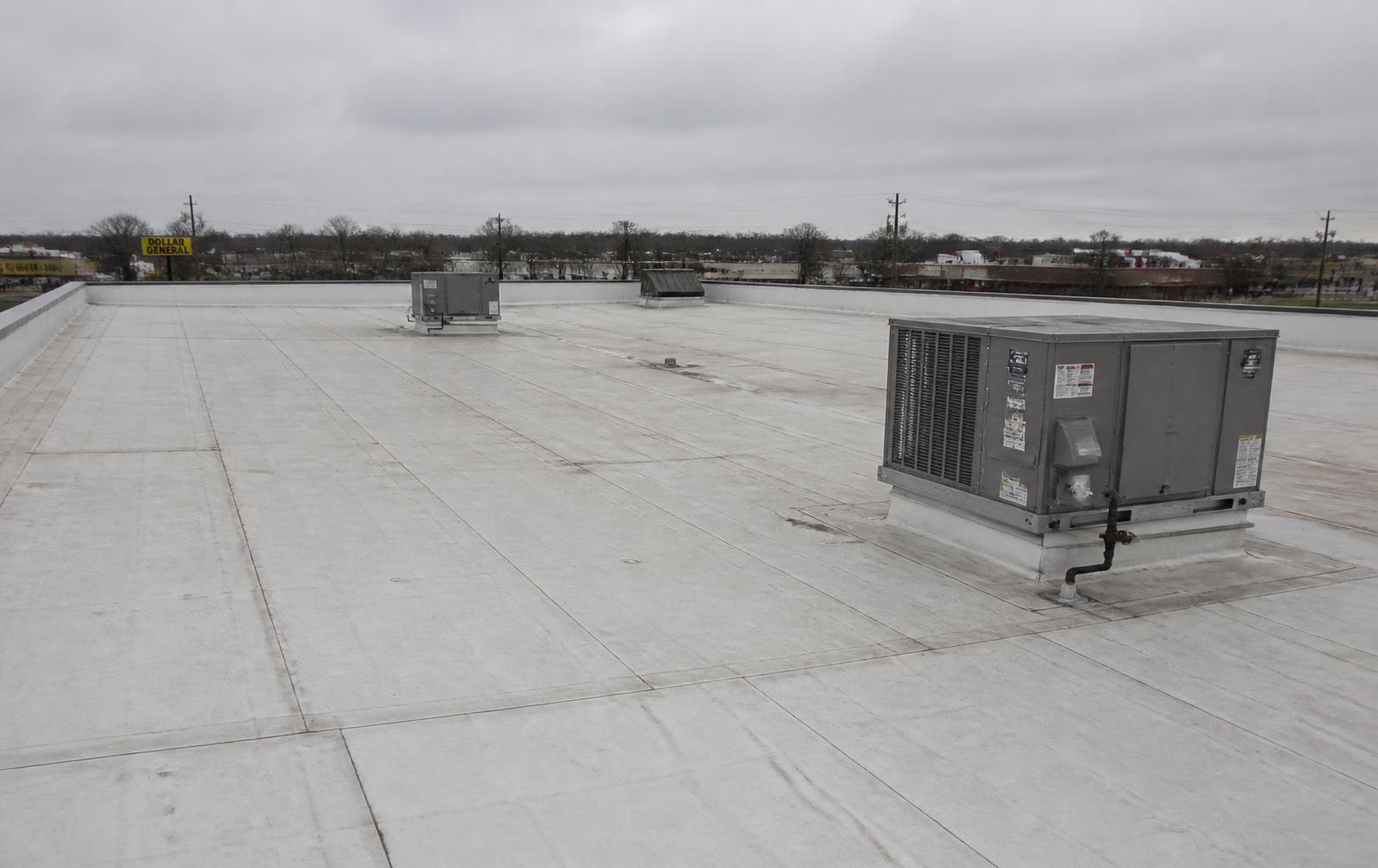 Flat commercial roof with rooftop HVAC units